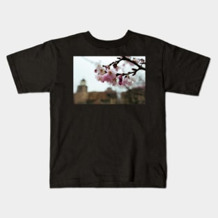 Flowers with blurry building Kids T-Shirt